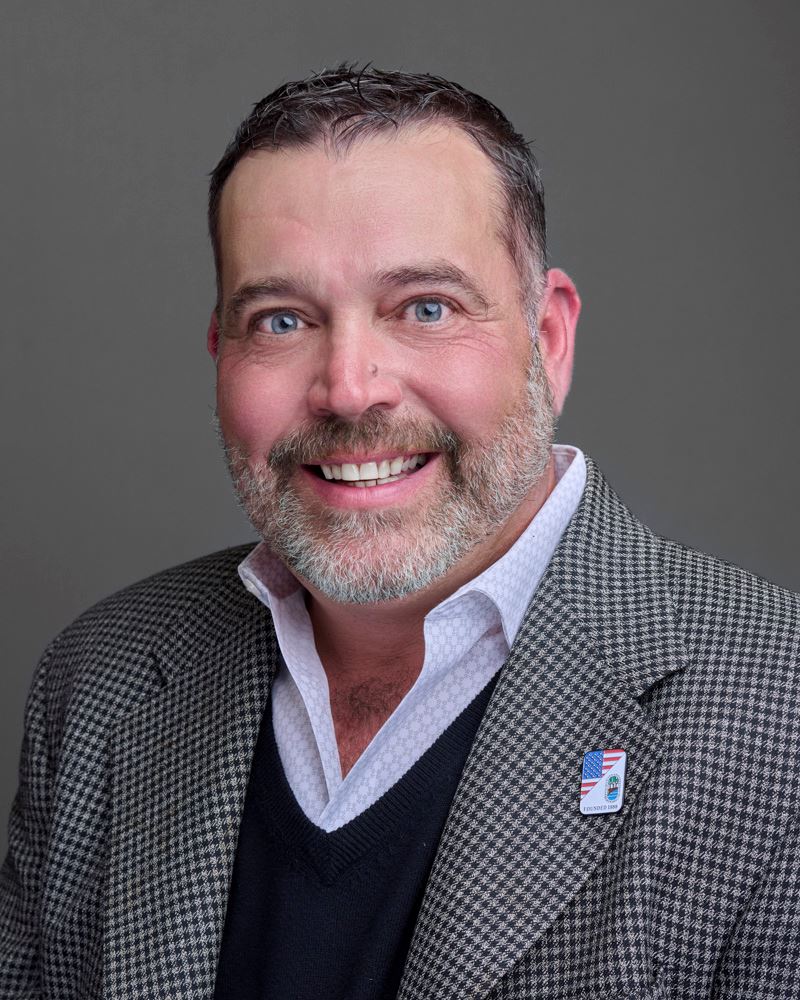 Brock Leder Headshot with grey background
